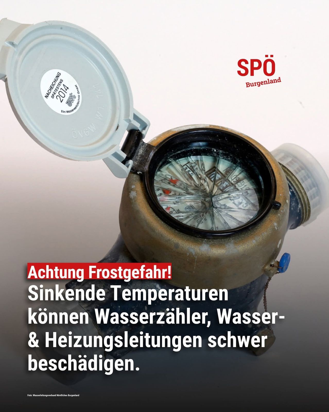 A poster with an open water meter showing an interior with a compass and warning about freezing dangers. The text reads 'Attention Frost Risk!' and warns of potential damage to water meters and pipelines.