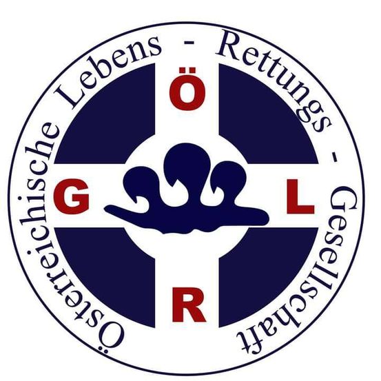 Das Logo der Deutschen Lebensrettungsgesellschaft zeigt ein blaues Kreuz und einen roten Buchstaben 'R' mit einer Hand im Inneren, umgeben von den Buchstaben 'G' und 'L'.