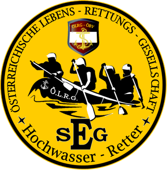 Ein gelbes kreisförmiges Logo zeigt ein Boot mit vier Paddlern. Die Textur 'O.L.R.G.' steht in der Mitte, und 'SEG' ist darunter. Die Worte 'Osterreichische Lebensrettungs-Gesellschaf' sind um das Boot herum.