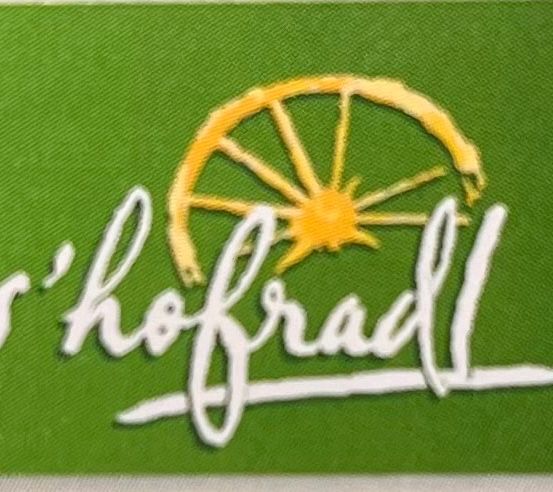 Bild enthält, Logo, Machine, Spoke, Wheel, Text, Handwriting