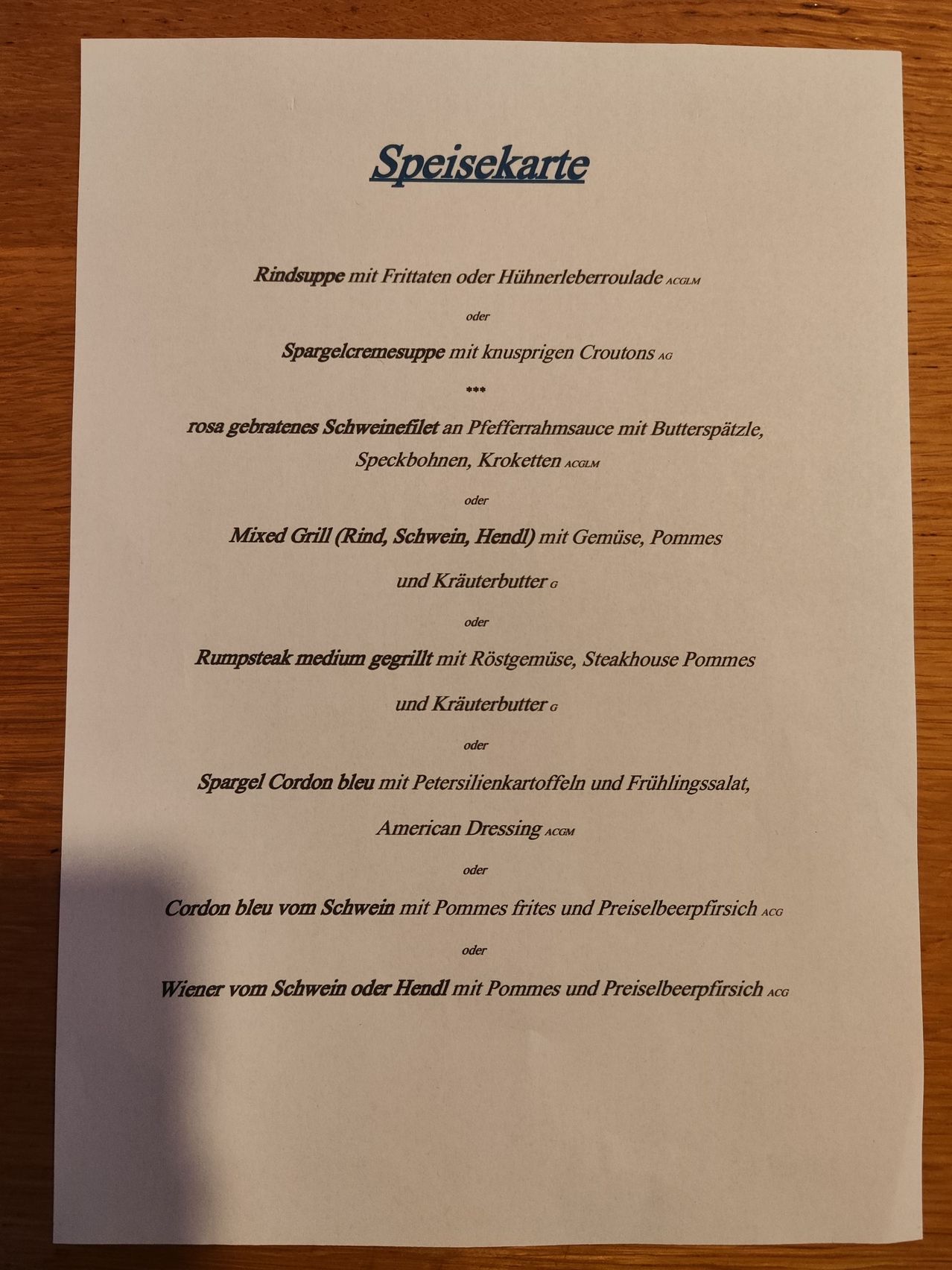 A menu lists beef soup with fried potatoes or chicken liver sauce, asparagus cream soup with crispy croutons, pork tenderloin with pepper sauce, mixed grill with vegetables and potatoes, and more.