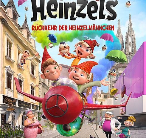 Filmplakat für 'Die Heinzels' zeigt animierte Charaktere, die über eine Stadt mit bunten Gebäuden fliegen und abspringen. Charaktere in Hüten und Kostümen scheinen in fröhlicher Stimmung zu sein.
