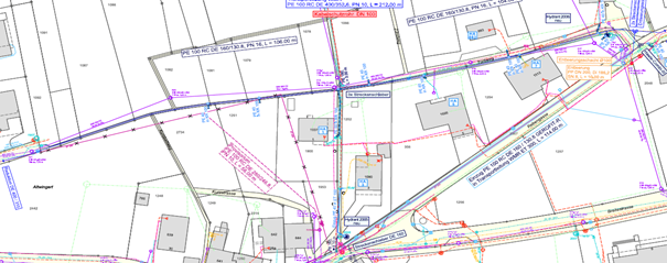 The map shows a city layout with various colored lines indicating roads, railways, and utilities. Buildings and structures are marked with rectangles, and there are annotations and measurements throughout.