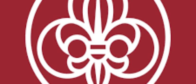 Ein weißes Fleur-de-Lis-Logo in einem roten Kreis auf rotem Hintergrund.