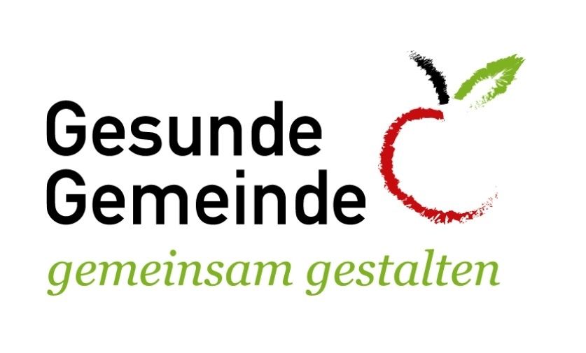Ein Logo mit dem Text 'Gesunde Gemeinde' mit einer roten Apfelillustration über dem Text. Unten steht 'gemeinschaft gestalten'.