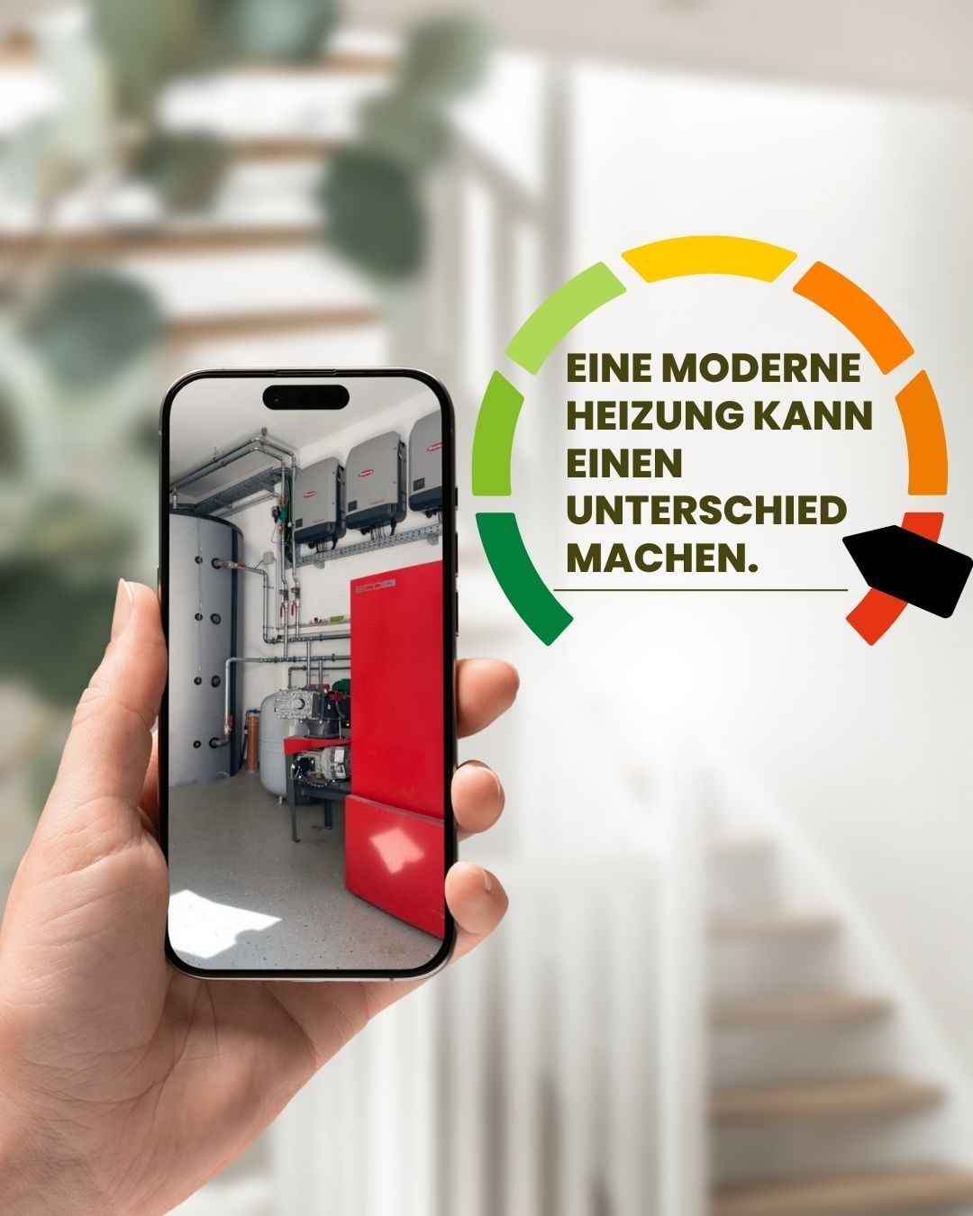 Hand holding a smartphone displaying an image of a heating system. The background shows a modern home interior with a staircase.