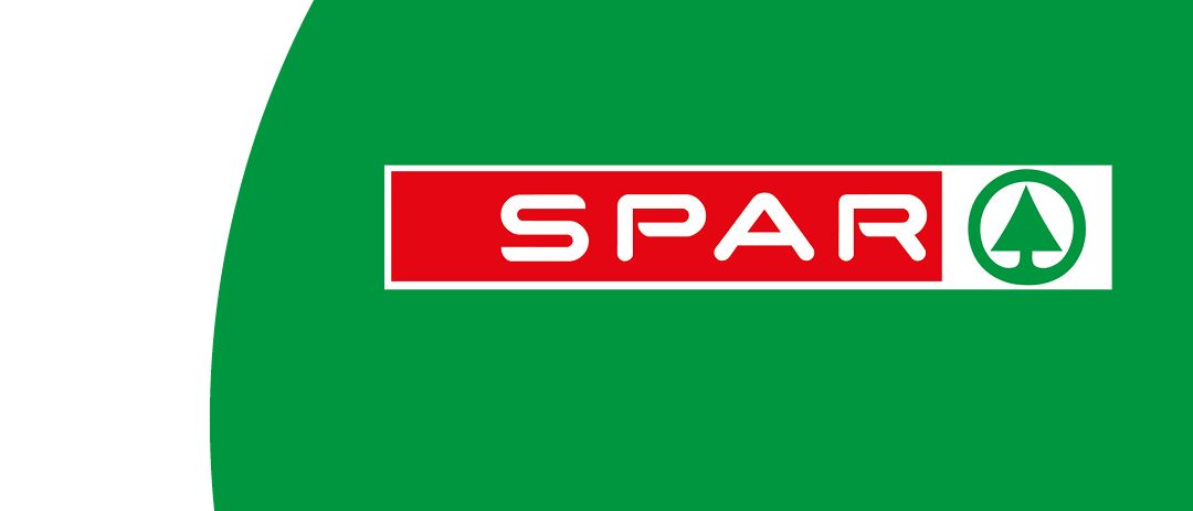 Grüner Kreis mit rotem und weißem Logo 'SPAR' in der Mitte.