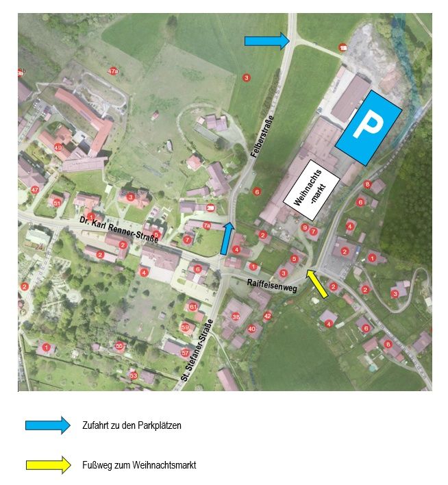 Eine Karte zeigt die Anordnung eines Dorfes mit nummerierten Gebäuden und Straßen. Pfeile zeigen auf Parkplätze und einen Weihnachtsmarkt. Die Karte enthält eine Legende mit Symbolen für Straßen, Parkplätze und einen Weihnachtsmarkt.
