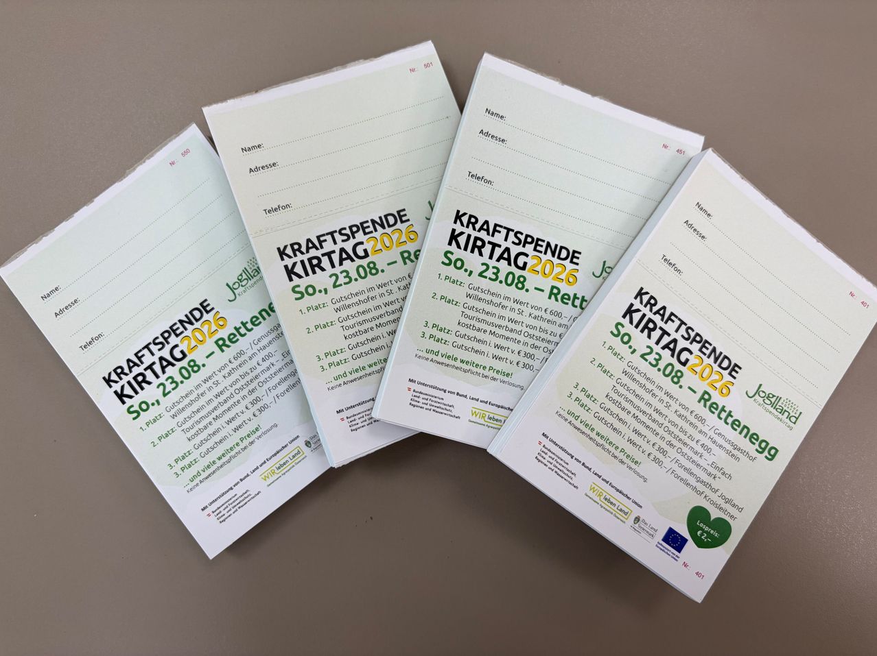 Four documents titled 'Kraftspende Kirtag 2026' are displayed, each with a date of August 23, 2026, and various vouchers for different locations.