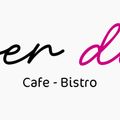 Das Logo für ein Café und Bistro namens 'Open Du', mit einer stilisierten kursiven Schrift, 'Open' in Schwarz und 'Du' in Pink. Darunter steht der Text 'Café - Bistro'.