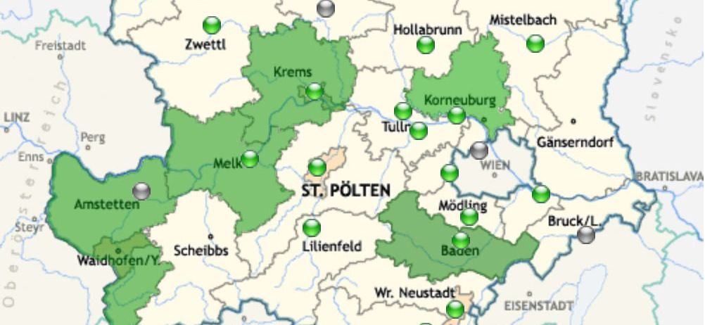 Eine Karte Österreichs, die die Regionen St. Pölten, Wien, Krems und Tulln hervorhebt. Verschiedene Städte und Sehenswürdigkeiten sind markiert, wobei grüne Kreise bestimmte Orte anzeigen.