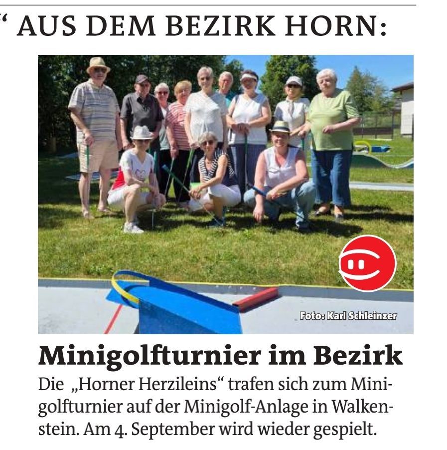 A group of people are posing with golf clubs on a grassy field. They are smiling and looking at the camera. The place is surrounded by a fence. The text on the image reads, 'Minigolfturnier im Bezirk'.