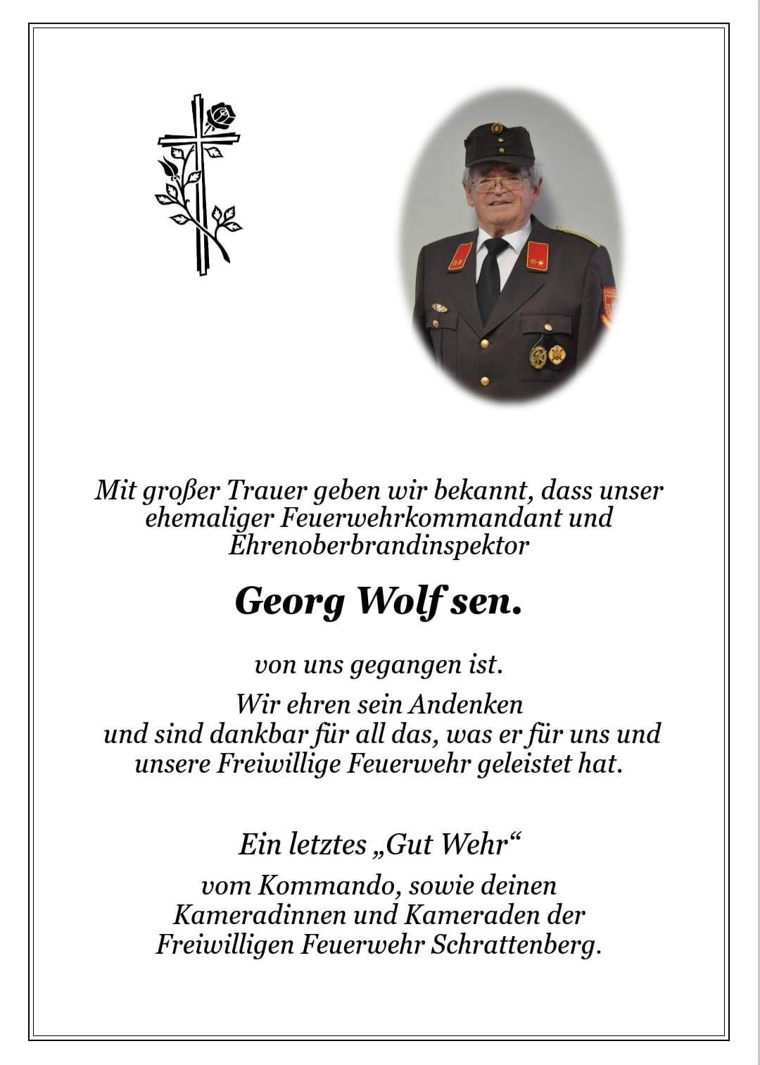 Eine Todesanzeige für Georg Wolf, ehemaligen Feuerwehrkommandanten und Ehrenoberbrandinspektor, der verstorben ist. Der Text drückt tiefe Trauer und Dankbarkeit für seinen Dienst aus. Er endet mit einem Abschiedsgruß.