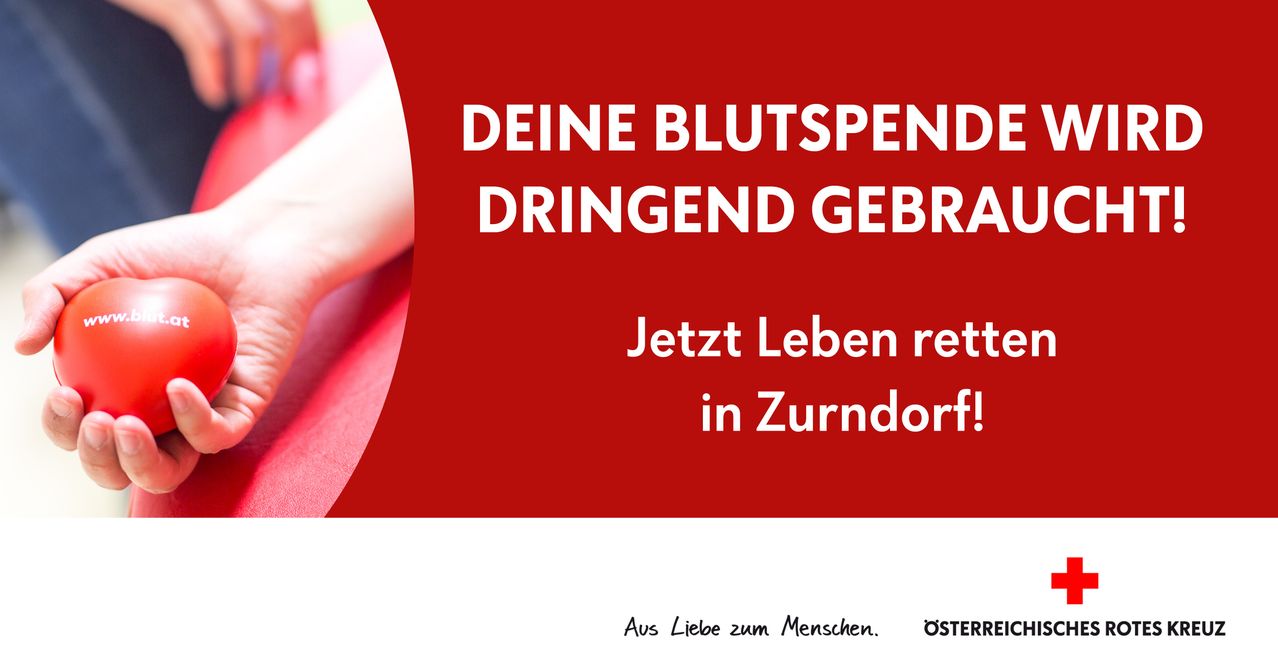 Roter Plakat mit weißem Text, der 'Ihre Blutspende wird dringend benötigt. Retten Sie jetzt Leben in Zurndorf.' Eine Hand ist teilweise links sichtbar.