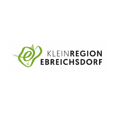 Das Logo der Kleinregion Ebreisddorf. Es zeigt eine grüne Ikone, die einem Fahrrad und einem Blatt ähnelt und umweltfreundliches Radfahren symbolisiert.