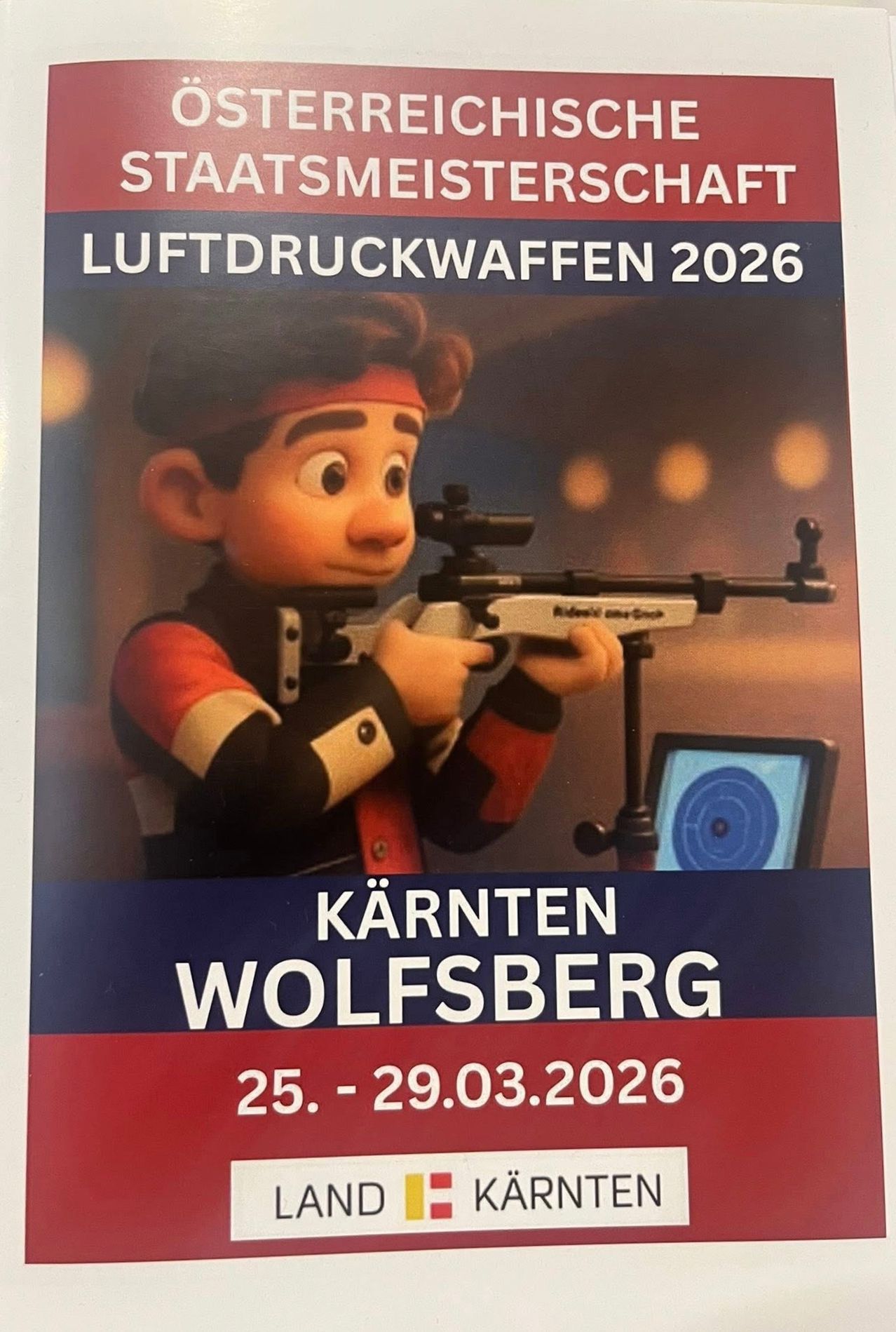 Plakat für die Luftdruckwaffen-Veranstaltung 2026 in Wolfsberg, Österreich. Es zeigt eine Comicfigur mit einem Gewehr, mit den Daten 25. bis 29.03.2026.