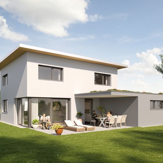 Ein modernes Haus mit Glasfenstern und -türen, mit einer Familie, die ein Outdoor-Essen mit Tisch und Stühlen genießt. Das Haus hat einen Rasen und ein grünes Dach.