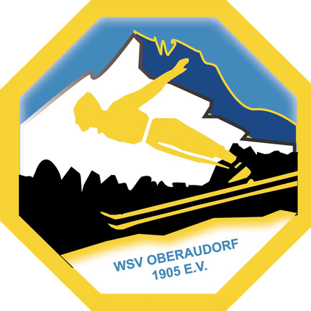 Ein gelbes Sechseck-Logo mit einem Skifahrer mitten im Sprung, verschneite Berge im Hintergrund und dem Text 'WSV OBERAUDORF 1905 E.V.' darunter.