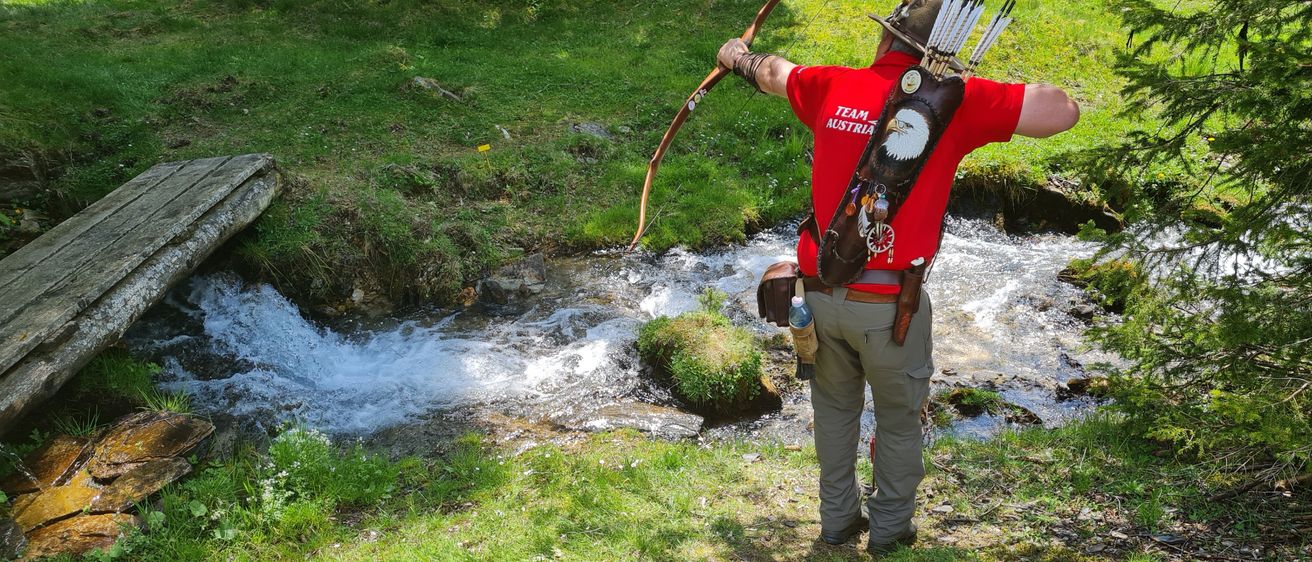 Bild enthält, Grass, Vegetation, Rock, Weapon, Bow, Outdoors, Water, Nature, Photography, Portrait