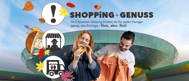 Ein Mann und eine Frau essen und halten einen Mantel vor einem Einkaufszentrum mit Herbstblättern und einem LKW-Symbol. Der Text lautet 'SHOPPING + GENUSS' und 'Im Citycenter Güssing findest du für jeden Hunger genau das Richtige - Klein, aber fein!'.