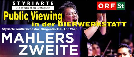 An image of Mei-Ann Chen, a female conductor, passionately singing and holding a microphone. She wears glasses and a black outfit. The background is blurry with musical instruments visible.