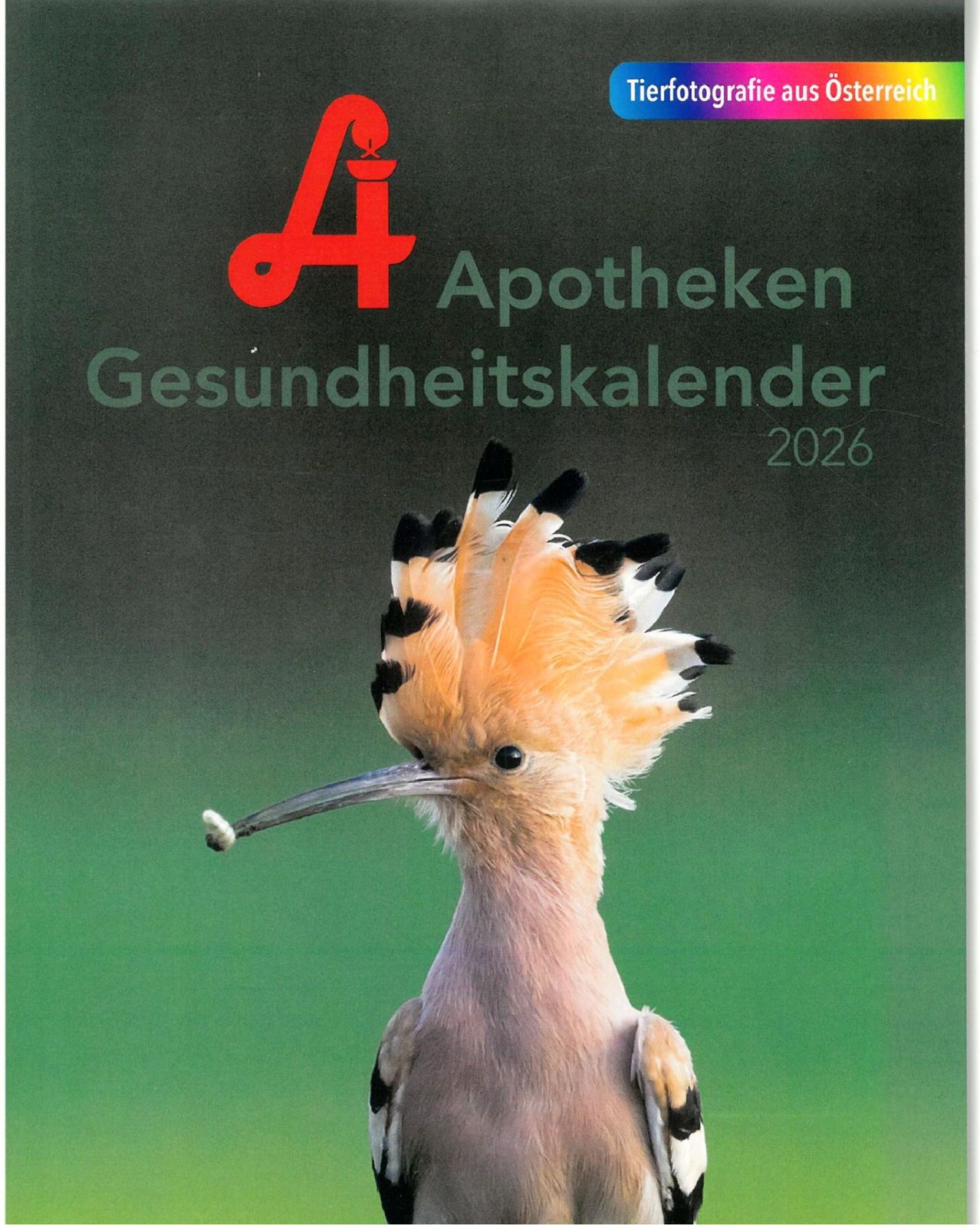 A poster for the 2026 Apotheken Gesundheitskalender features a bird with bright orange and black feathers. The bird has a long beak and a tuft of feathers on its head. The poster has a dark green background.