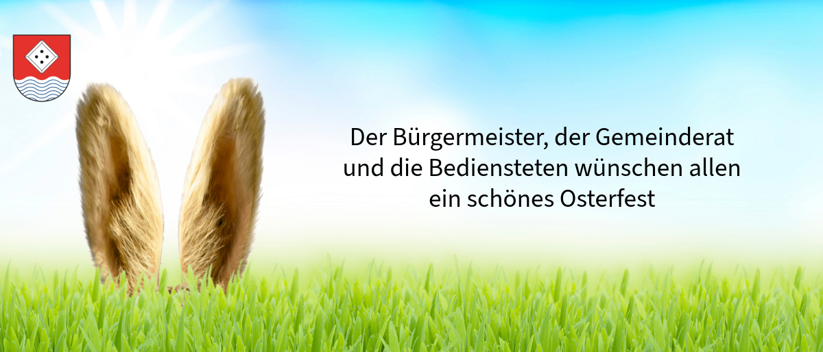Ein Grasfeld mit einem Textüberlagerung, der 'Der Bürgermeister, die Gemeinde und die Angestellten wünschen ein schönes Osterfest' lautet.