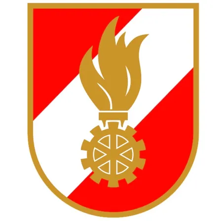 Eine goldene Flamme ruht auf einem Zahnrad in einem rot-weissen Wappen mit goldenem Rand.