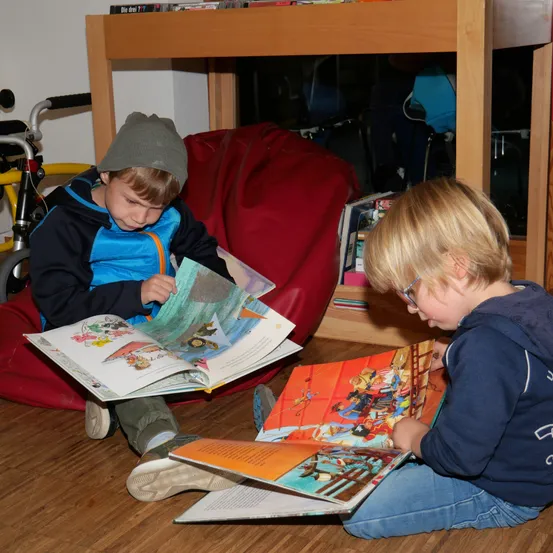 Wood, Plywood, Hardwood, Person, Reading, Flooring, Boy, Child, Male, Hat