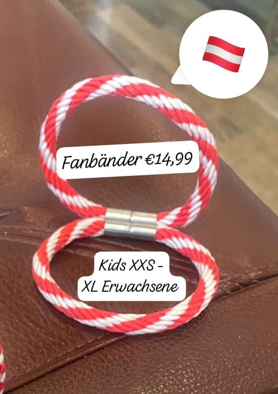 Rot-weiße Seilbänder mit silbernen Verschlüssen auf einer braunen Lederoberfläche, beschriftet mit Größen Kids XXS-XL und Preis 14,99 Euro.