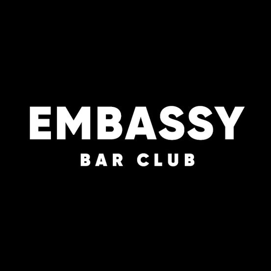 Das Bild zeigt ein einfaches Logo für einen Bar Club namens Embassy Bar Club, das auf einem schwarzen Hintergrund dargestellt ist.