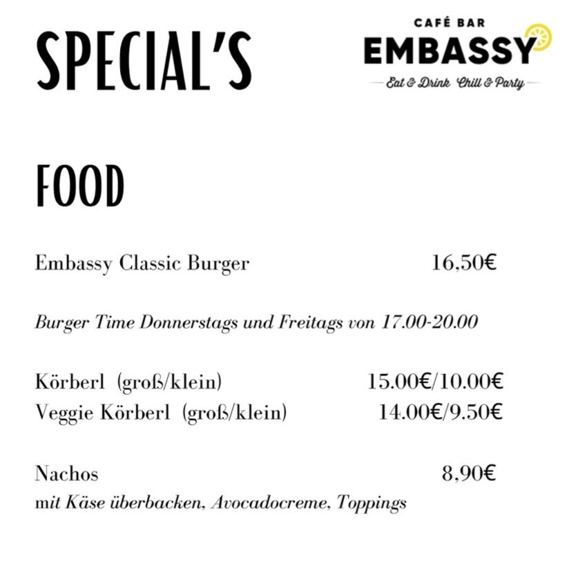 Specials food menu for Embassy Cafe Bar. Includes Embassy Classic Burger, large and small Korberl, veggie Korberl, and nachos. Prices in euros. Open Thursdays and Fridays from 5pm to 8pm.
