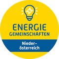 Ein gelber kreisförmiger Logo mit einer Glühbirne-Symbol. Darunter stehen die Worte 'Energie Gemeinschaften' und darunter steht 'Nieder-osterreich' in kleinerer Schrift.