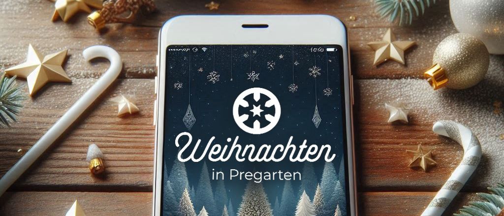 Ein weißes iPhone zeigt eine Weihnachtsszene mit einem Schneeflockenlogo und dem Text 'Weihnachten in Praegerten'. Der Bildschirm zeigt Schneemänner und eine verschneite Landschaft. Das Telefon liegt auf einer Holzoberfläche mit Weihnachtsdekoration.