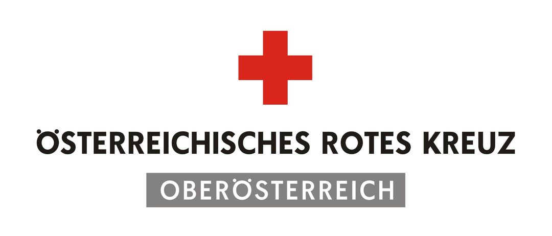Das Logo des Roten Kreuzes in Oberösterreich mit dem Motto 'Mit Liebe zum Menschen'.