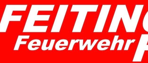 Ein rotes Schild mit weißem Text, das 'EITINGer neuerverhr FES' sagt.