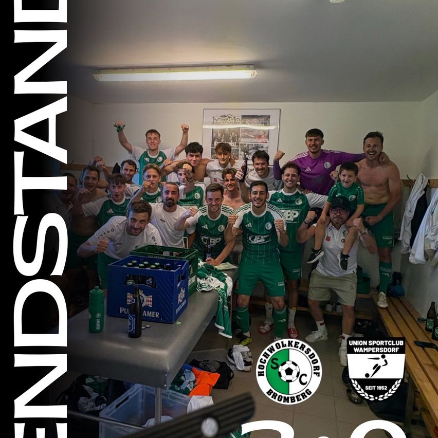 A group of soccer players in green uniforms celebrate in a locker room with bottles and a crate of beer.