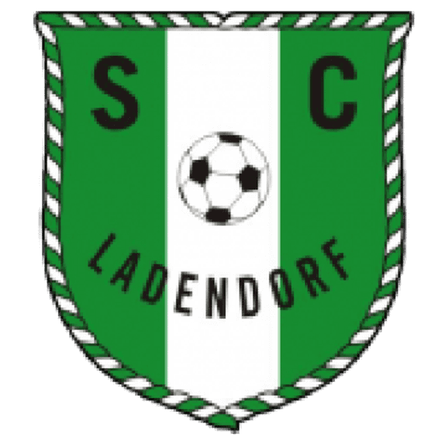 Das grüne und weiße Fußballclub-Logo zeigt die Buchstaben SC in den oberen Ecken mit einem Fußball in der Mitte. Unter dem Ball steht der Text 'LADENDORE'.