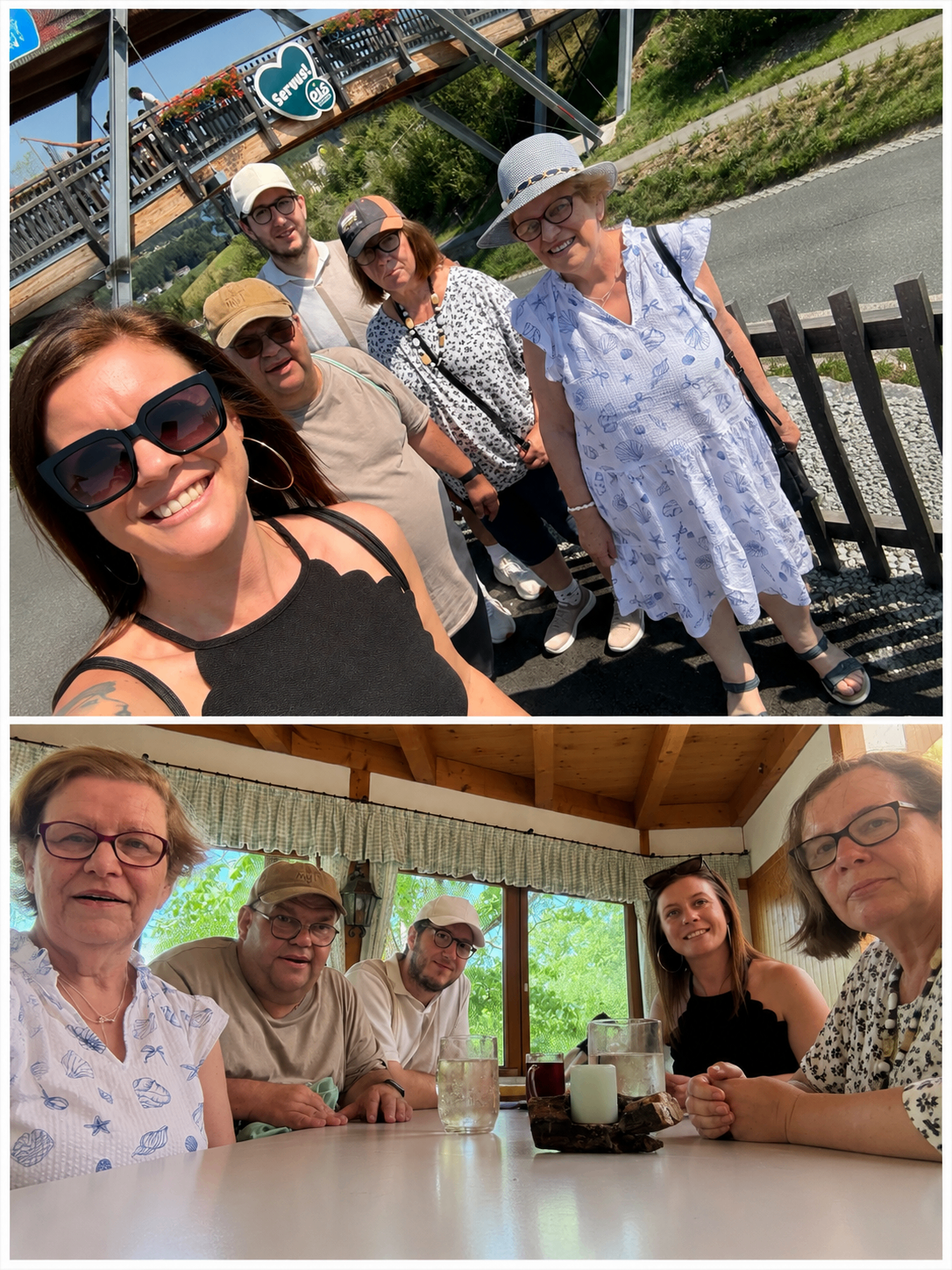 Eine Gruppe von Menschen, die an einem sonnigen Tag lächelnd für ein Foto posieren, wobei einige in der Nähe eines Holzzauns stehen und andere an einem Tisch im Innenbereich sitzen.