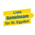 Ein gelbes Schild mit blauem Text lautet 'Liste Gemeinschaft für St. Egyden', was auf eine Gemeinschaftsliste für St. Egyden hindeutet.