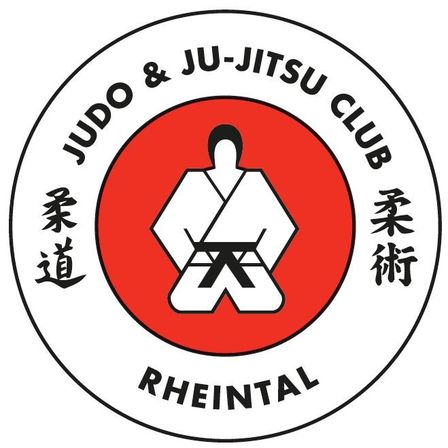 Das Logo des Judo & Ju-Jitsu Clubs Rheintal zeigt einen roten Kreis mit einer Person in weißer Kampfsportuniform, die in der Mitte kniet. Der Text 'Judo & Ju-Jitsu Club' steht oben, mit 'Rheintal' unten, umgeben von japanischen Schriftzeichen.