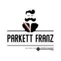 Das Logo von Parkett Franz zeigt einen Mann mit Schnurrbart, der einen Anzug und eine Krawatte trägt. Der Text ist fett und zentriert. Unten befindet sich ein kleines Logo.