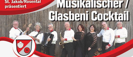 Eine Gruppe von Musikern posiert für ein Foto vor einer Holzwand, mit dem Text 'Marktgemeinde Jakob/Rosental sentiert' oben.