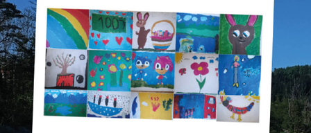 Ein Leinwand mit mehreren Kinderzeichnungen steht auf einem Staffelei am Fluss und zeigt verschiedene farbenfrohe Illustrationen.