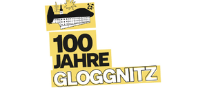 Ein goldenes Schild zur Feier von 100 Jahren Gloggnitz, mit einer Silhouette einer Burg auf einem Hügel und einem Sonnenaufgang im Hintergrund.