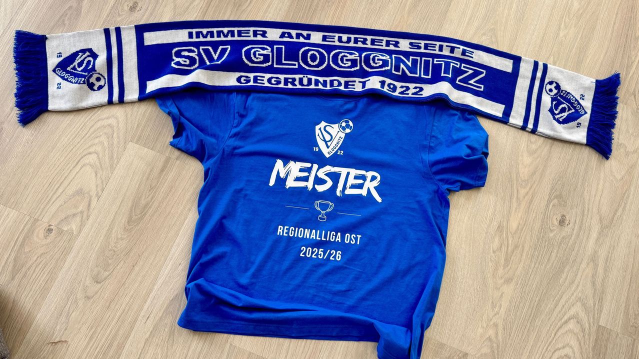 A blue soccer jersey with the text 'MEISTER' and a trophy logo. It also says 'Regionalliga Ost 2025/26'. It is from 'SV Gloggnitzer', founded in 1922.