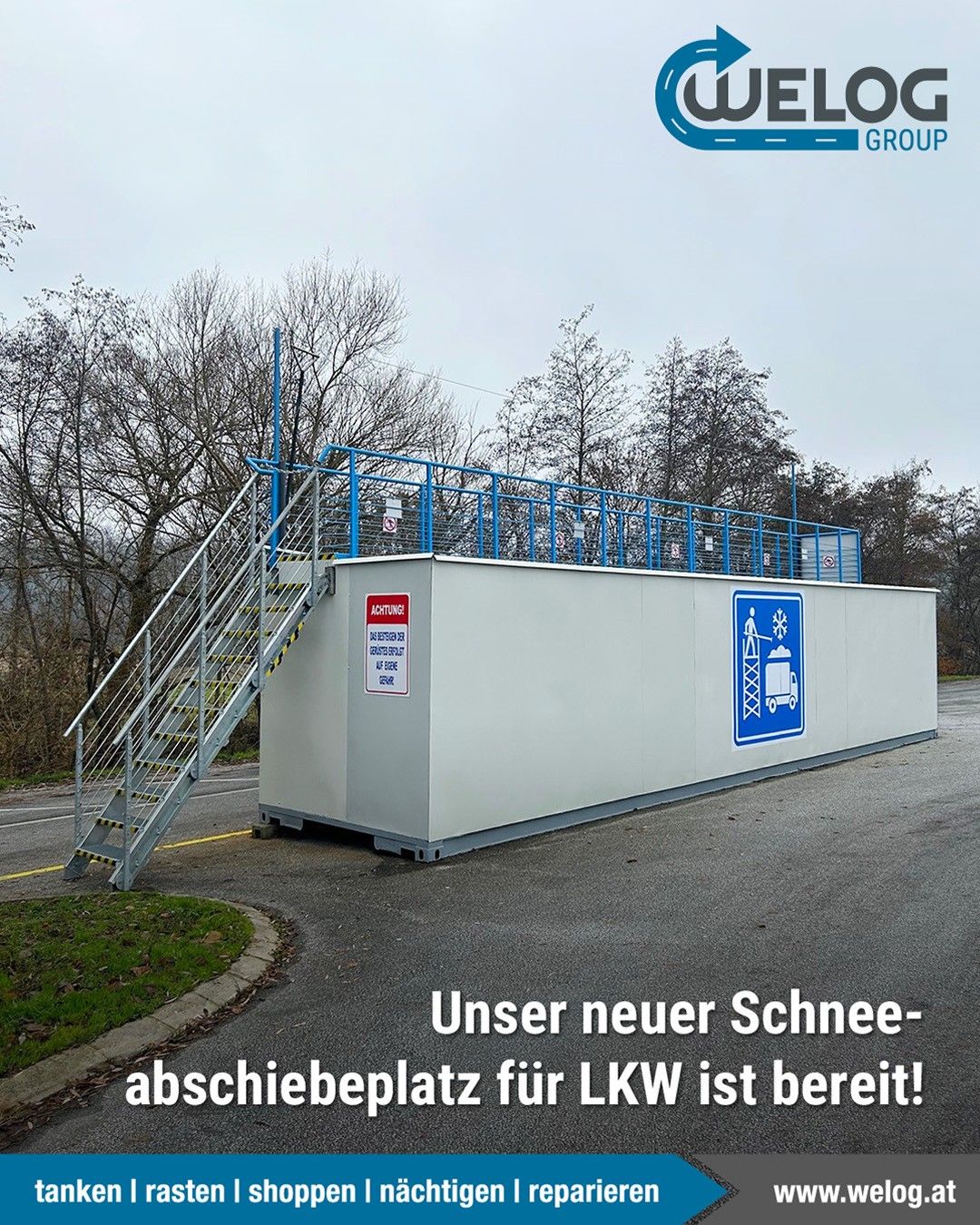 A new snow removal platform for LKW is ready, with a staircase and safety railings. The platform has a sign warning of icy conditions.