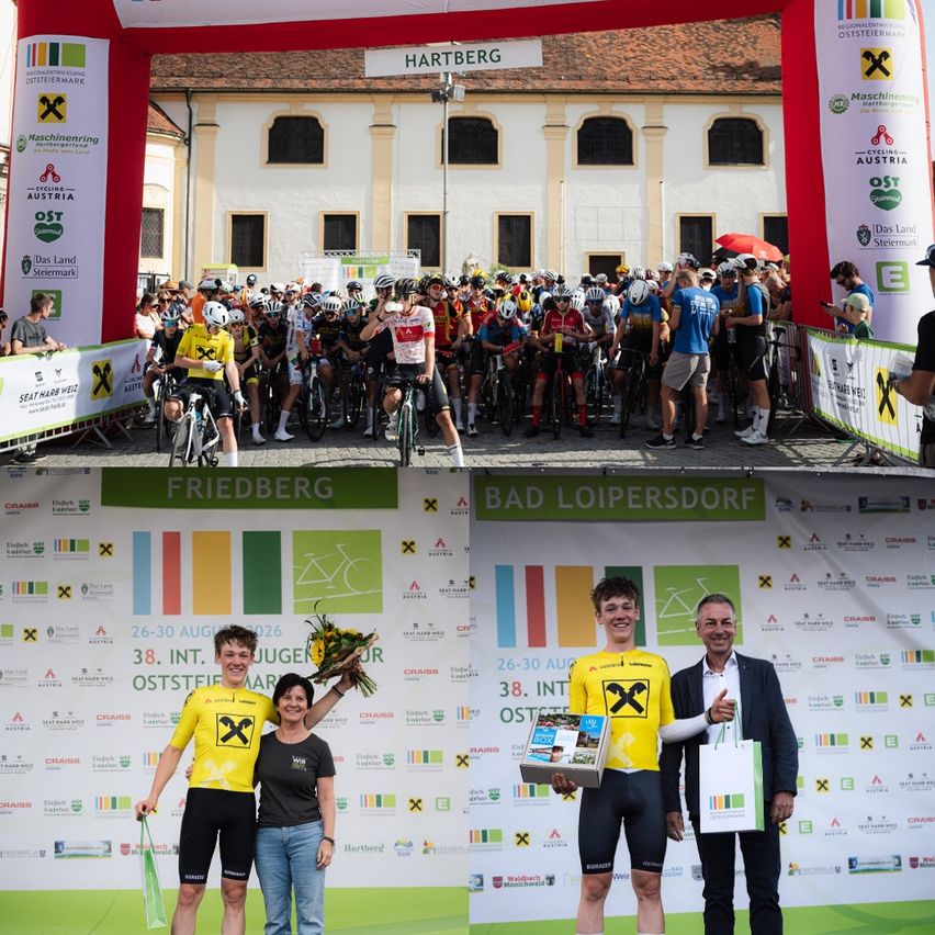 Eine Gruppe von Radfahrern in gelben Trikots steht auf einem Podium mit einem Mann im Anzug, der eine Box und einen Blumenstrauß hält. Dahinter versammelt sich eine Menge vor einem Banner.