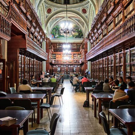 Book, Indoors, Library, Building, Adult, Female, Person, Woman, Restaurant, Chair