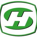 Ein grünes und weißes Schild-förmiges Logo mit einem geschwungenen Buchstaben 'H' in der Mitte, vor schwarzem Hintergrund.